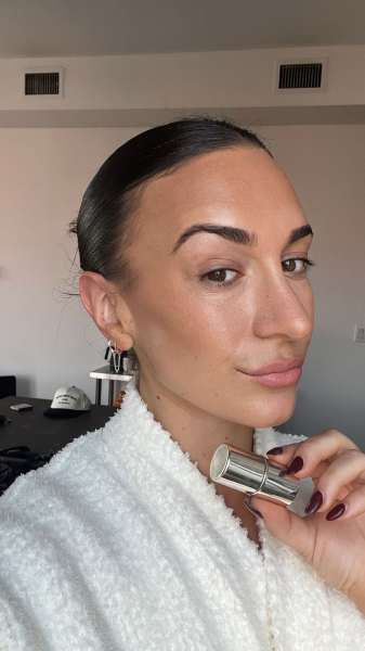 Image may contain Mina Orfanou Adult Person Body Part Face Head Neck Cosmetics Lipstick Clothing and Hat